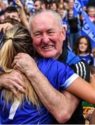 31 July 2022; Laois supporter Mick Moore celebrates with players the TG4 All-Ireland Ladies Football Intermediate Championship Final match between Laois and Wexford at Croke Park in Dublin. Photo by Piaras Ó Mídheach/Sportsfile