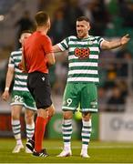 4 August 2022; Aaron Greene of Shamrock Rovers protests to referee Bartosz Frankowski during the UEFA Europa League third qualifying round first leg match between Shamrock Rovers and Shkupi at Tallaght Stadium in Dublin. Photo by Eóin Noonan/Sportsfile