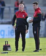 5 August 2022; Ballymun Kickhams manager Brendan Hackett with goalkeeper Evan Comerford during the warm-up before the Dublin Senior Club Football Championship Group 2 match between Ballymun Kickhams and Clontarf at Parnell Park in Dublin. Photo by Piaras Ó Mídheach/Sportsfile