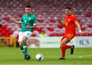 6 August 2022; Adam Crowley of Republic of Ireland in action against Matty Hill during the Amateur International match between Republic of Ireland and Wales at Turner's Cross in Cork. Photo by Michael P Ryan/Sportsfile