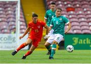 6 August 2022; AJ O'Connor of Republic of Ireland in action against Matty Hill during the Amateur International match between Republic of Ireland and Wales at Turner's Cross in Cork. Photo by Michael P Ryan/Sportsfile