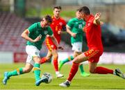 6 August 2022; Eoin Murphy of Republic of Ireland in action against Jordan Carrington of Wales during the Amateur International match between Republic of Ireland and Wales at Turner's Cross in Cork. Photo by Michael P Ryan/Sportsfile