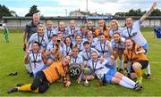 6 August 2022; Eastern Women's Football League players and management celebrate with the trophy after their side's victory in the FAI Women's Angela Hearst InterLeague Cup Final match between Wexford & District Women's League and Eastern Women's Football League at Arklow Town FC, in Wicklow. Photo by Seb Daly/Sportsfile