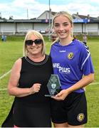 6 August 2022; Katie Murphy of Wexford & District Women's League is presented with her Player of the Match award by Ebbie Hearst after the FAI Women's Angela Hearst InterLeague Cup Final match between Wexford & District Women's League and Eastern Women's Football League at Arklow Town FC, in Wicklow. Photo by Seb Daly/Sportsfile