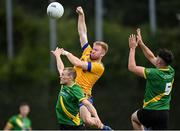 6 August 2022; Aaron Byrne of Na Fianna in action against Thomas Davis players Adam Fallon, left, and Josh Lambert during the Dublin County Senior Club Football Championship Group 3 match between Thomas Davis and Na Fianna at Parnell Park in Dublin. Photo by Piaras Ó Mídheach/Sportsfile