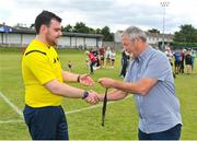 6 August 2022; Referee Cillian O'Reilly is presented with his medal by FAI youth and amateur committee member Dave Moran after the FAI Women's Angela Hearst InterLeague Cup Final match between Wexford & District Women's League and Eastern Women's Football League at Arklow Town FC, in Wicklow. Photo by Seb Daly/Sportsfile
