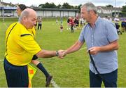 6 August 2022; Assistant referee Willie O'Brien is presented with his medal by FAI youth and amateur committee member Dave Moran after the FAI Women's Angela Hearst InterLeague Cup Final match between Wexford & District Women's League and Eastern Women's Football League at Arklow Town FC, in Wicklow. Photo by Seb Daly/Sportsfile