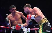 6 August 2022; Sean McComb, right, knocks out the gumshield of Ramiro Blanco during their super-lightweight bout at SSE Arena in Belfast. Photo by Ramsey Cardy/Sportsfile