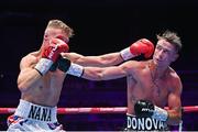 6 August 2022; Paddy Donovan, right, and Tom Hill during their welterweight bout at SSE Arena in Belfast. Photo by Ramsey Cardy/Sportsfile