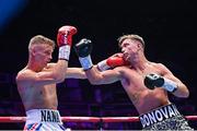 6 August 2022; Paddy Donovan, right, and Tom Hill during their welterweight bout at SSE Arena in Belfast. Photo by Ramsey Cardy/Sportsfile