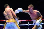 6 August 2022; Kurt Walker, right, and Marcos Gabriel Martinez during their featherweight bout at SSE Arena in Belfast. Photo by Ramsey Cardy/Sportsfile