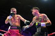 6 August 2022; Tyrone McKenna, right, and Chris Jenkins during their welterweight bout at SSE Arena in Belfast. Photo by Ramsey Cardy/Sportsfile