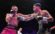 6 August 2022; Tyrone McKenna, right, and Chris Jenkins during their welterweight bout at SSE Arena in Belfast. Photo by Ramsey Cardy/Sportsfile