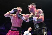 6 August 2022; Tyrone McKenna, right, and Chris Jenkins during their welterweight bout at SSE Arena in Belfast. Photo by Ramsey Cardy/Sportsfile