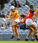 7 August 2022; Dervla Cosgrove of Antrim scores her side's second goal, under pressure from Nicola Woods of Armagh, during the Glen Dimplex All-Ireland Premier Junior Camogie Championship Final match between Antrim and Armagh at Croke Park in Dublin. Photo by Piaras Ó Mídheach/Sportsfile
