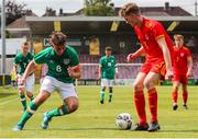 6 August 2022; Eoin Murphy of Republic of Ireland in action against Ryan Cain of Wales during the Amateur International match between Republic of Ireland and Wales at Turner's Cross in Cork. Photo by Michael P Ryan/Sportsfile