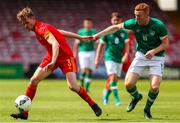 6 August 2022; Ryan Cain of Wales in action against Derek Hyland of Republic of Ireland during the Amateur International match between Republic of Ireland and Wales at Turner's Cross in Cork. Photo by Michael P Ryan/Sportsfile