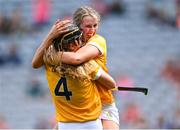 7 August 2022; Antrim players Caoimhe McNaughton, right, and Enya McShane celebrate after their side's victory in the Glen Dimplex All-Ireland Premier Junior Camogie Championship Final match between Antrim and Armagh at Croke Park in Dublin. Photo by Piaras Ó Mídheach/Sportsfile