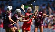 7 August 2022; Cliona O’Callaghan of Cork in action against Galway players, from left, Lisa Casserly, Ally Hesnan and Caoimhe Starr during the Glen Dimplex All-Ireland Intermediate Camogie Championship Final match between Cork and Galway at Croke Park in Dublin. Photo by Piaras Ó Mídheach/Sportsfile