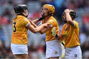 7 August 2022; Antrim players, from left, Eilis Kearns, Megan McGarry, and Enya McShane celebrate after their side's victory in the Glen Dimplex All-Ireland Premier Junior Camogie Championship Final match between Antrim and Armagh at Croke Park in Dublin. Photo by Piaras Ó Mídheach/Sportsfile