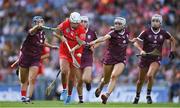 7 August 2022; Katelyn Hickey of Cork in action against Jennifer Hughes, left, and Katie Anna Porter of Galway during the Glen Dimplex All-Ireland Intermediate Camogie Championship Final match between Cork and Galway at Croke Park in Dublin. Photo by Seb Daly/Sportsfile