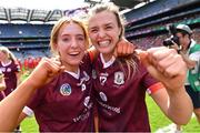 7 August 2022; Galway players Ciara Hickey, left, and Caoimhe Reidy celebrate after their side's victory in the Glen Dimplex All-Ireland Intermediate Camogie Championship Final match between Cork and Galway at Croke Park in Dublin. Photo by Piaras Ó Mídheach/Sportsfile