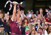 7 August 2022; Galway captain Lisa Casserly lifts the Jack McGrath Cup after her side's victory the Glen Dimplex All-Ireland Intermediate Camogie Championship Final match between Cork and Galway at Croke Park in Dublin. Photo by Seb Daly/Sportsfile