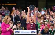 7 August 2022; Galway captain Lisa Casserly lifts the Jack McGrath Cup after her side's victory the Glen Dimplex All-Ireland Intermediate Camogie Championship Final match between Cork and Galway at Croke Park in Dublin. Photo by Seb Daly/Sportsfile