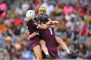 7 August 2022; Galway players, from left, Lisa Casserly, Ciara Donohue and Fiona Ryan celebrate after their side's victory in the Glen Dimplex All-Ireland Intermediate Camogie Championship Final match between Cork and Galway at Croke Park in Dublin. Photo by Seb Daly/Sportsfile