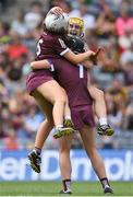 7 August 2022; Galway players, from left, Lisa Casserly, Ciara Donohue and Fiona Ryan celebrate after their side's victory in the Glen Dimplex All-Ireland Intermediate Camogie Championship Final match between Cork and Galway at Croke Park in Dublin. Photo by Seb Daly/Sportsfile