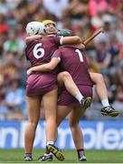 7 August 2022; Galway players, from left, Lisa Casserly, Ciara Donohue and Fiona Ryan celebrate after their side's victory in the Glen Dimplex All-Ireland Intermediate Camogie Championship Final match between Cork and Galway at Croke Park in Dublin. Photo by Seb Daly/Sportsfile