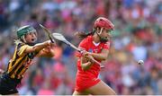 7 August 2022; Fiona Keating of Cork shoots to score her side's first goal, despite pressure from Kilkenny Michelle Teehan, during the Glen Dimplex All-Ireland Senior Camogie Championship Final match between Cork and Kilkenny at Croke Park in Dublin. Photo by Seb Daly/Sportsfile