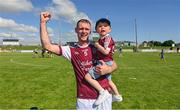 7 August 2022; Tommy Barrett of Causeway celebrates with his son Mason after the Kerry County Senior Hurling Championship Final match between Ballyduff and Causeway at Austin Stack Park in Tralee, Kerry. Photo by Brendan Moran/Sportsfile