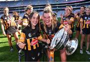 7 August 2022; Kilkenny captain Aoife Prendergast celebrates with supporter Katie Lonergan and the O'Duffy Cup after their side's victory in the Glen Dimplex All-Ireland Senior Camogie Championship Final match between Cork and Kilkenny at Croke Park in Dublin. Photo by Seb Daly/Sportsfile