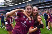 7 August 2022; Galway players Ally Hesnan, left, and Niamh McInerney celebrate after their side's victory in the Glen Dimplex All-Ireland Intermediate Camogie Championship Final match between Cork and Galway at Croke Park in Dublin. Photo by Piaras Ó Mídheach/Sportsfile
