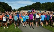 8 August 2022; Vhi ambassador and Olympian David Gillick pictured with participants before the Tymon parkrun where Vhi hosted a special event to celebrate their More Than Running campaign. David was on hand to lead the warm up for parkrun participants and is calling on people to attend a parkrun near you this summer and build it into their weekly routines by either walking, jogging, running or volunteering. parkruns have proved to improve participants fitness levels, along with physical heath, happiness and mental health. parkrun in partnership with Vhi support local communities in organising free, weekly, timed 5km runs every Saturday at 9.30am. To register for a parkrun near you visit www.parkrun.ie.  Photo by Seb Daly/Sportsfile