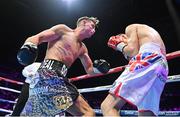 6 August 2022; Paddy Donovan, left, and Tom Hill during their welterweight bout at SSE Arena in Belfast. Photo by Ramsey Cardy/Sportsfile