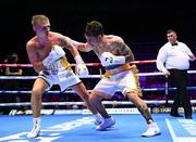 6 August 2022; Kurt Walker, left, and Marcos Gabriel Martinez during their featherweight bout at SSE Arena in Belfast. Photo by Ramsey Cardy/Sportsfile
