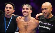 6 August 2022; Michael Conlan, centre, with his brother Jamie, left, and trainer Adam Booth, after his featherweight bout against Miguel Marriaga at SSE Arena in Belfast. Photo by Ramsey Cardy/Sportsfile