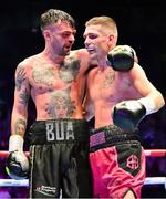 6 August 2022; Tyrone McKenna, left, and Chris Jenkins after their welterweight bout at SSE Arena in Belfast. Photo by Ramsey Cardy/Sportsfile