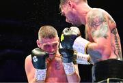 6 August 2022; Tyrone McKenna, right, and Chris Jenkins during their welterweight bout at SSE Arena in Belfast. Photo by Ramsey Cardy/Sportsfile