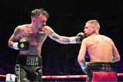 6 August 2022; Tyrone McKenna, left, and Chris Jenkins during their welterweight bout at SSE Arena in Belfast. Photo by Ramsey Cardy/Sportsfile