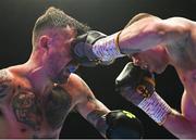6 August 2022; Tyrone McKenna, left, and Chris Jenkins during their welterweight bout at SSE Arena in Belfast. Photo by Ramsey Cardy/Sportsfile