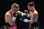 6 August 2022; Tyrone McKenna, right, and Chris Jenkins during their welterweight bout at SSE Arena in Belfast. Photo by Ramsey Cardy/Sportsfile
