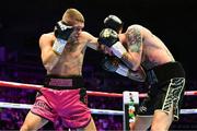 6 August 2022; Tyrone McKenna, right, and Chris Jenkins during their welterweight bout at SSE Arena in Belfast. Photo by Ramsey Cardy/Sportsfile