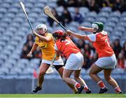 7 August 2022; Dervla Cosgrove of Antrim in action against Armagh players Nicola Woods, 3, and Ciarrai Devlin during the Glen Dimplex All-Ireland Premier Junior Camogie Championship Final match between Antrim and Armagh at Croke Park in Dublin. Photo by Piaras Ó Mídheach/Sportsfile