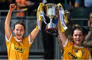 7 August 2022; Maria McLarnon, left, and Emma Laverty of Antrim lift the Kathleen Mills Cup after their side's victory in the Glen Dimplex All-Ireland Premier Junior Camogie Championship Final match between Antrim and Armagh at Croke Park in Dublin. Photo by Piaras Ó Mídheach/Sportsfile