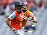 7 August 2022; Michelle McArdle of Armagh in action against Nuala Devlin of Antrim during the Glen Dimplex All-Ireland Premier Junior Camogie Championship Final match between Antrim and Armagh at Croke Park in Dublin. Photo by Piaras Ó Mídheach/Sportsfile