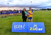 3 August 2022; Leinster LGFA President and LGFA vice-President Trina Murray presents the cup to Clare captain Emer Hynes after the ZuCar All-Ireland Ladies Football Minor ‘C’ Championship Final match between Clare and Wicklow at Kinnegad GAA club in Kinnegad, Westmeath. Photo by Piaras Ó Mídheach/Sportsfile