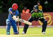 9 August 2022; Hashmatullah Shahidi of Afghanistan hits a four during the Men's T20 International match between Ireland and Afghanistan at Stormont in Belfast. Photo by Ramsey Cardy/Sportsfile